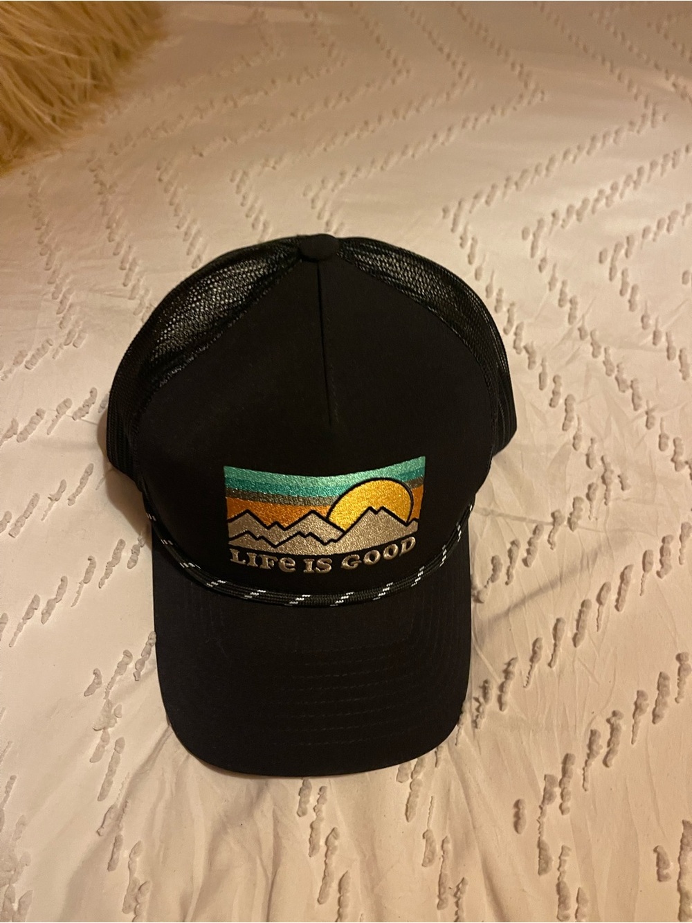 Life Is Good Black Trucker Hat with Sunset Mountain Patch